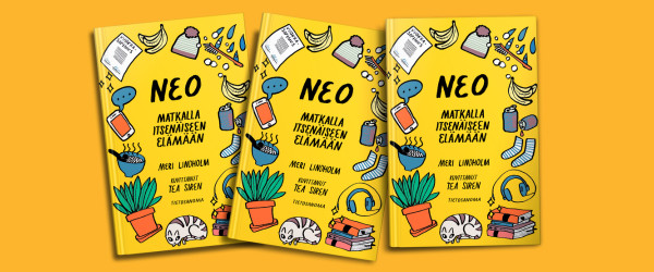 NEO-kirjan kansia kasassa.